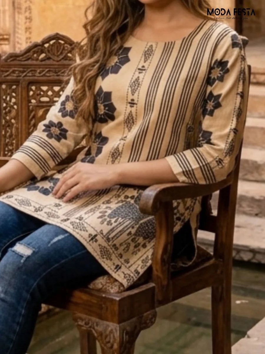 This beige kurti features a sophisticated fusion of geometric stripes and traditional black floral motifs, creating a stylish and contemporary ethnic look.