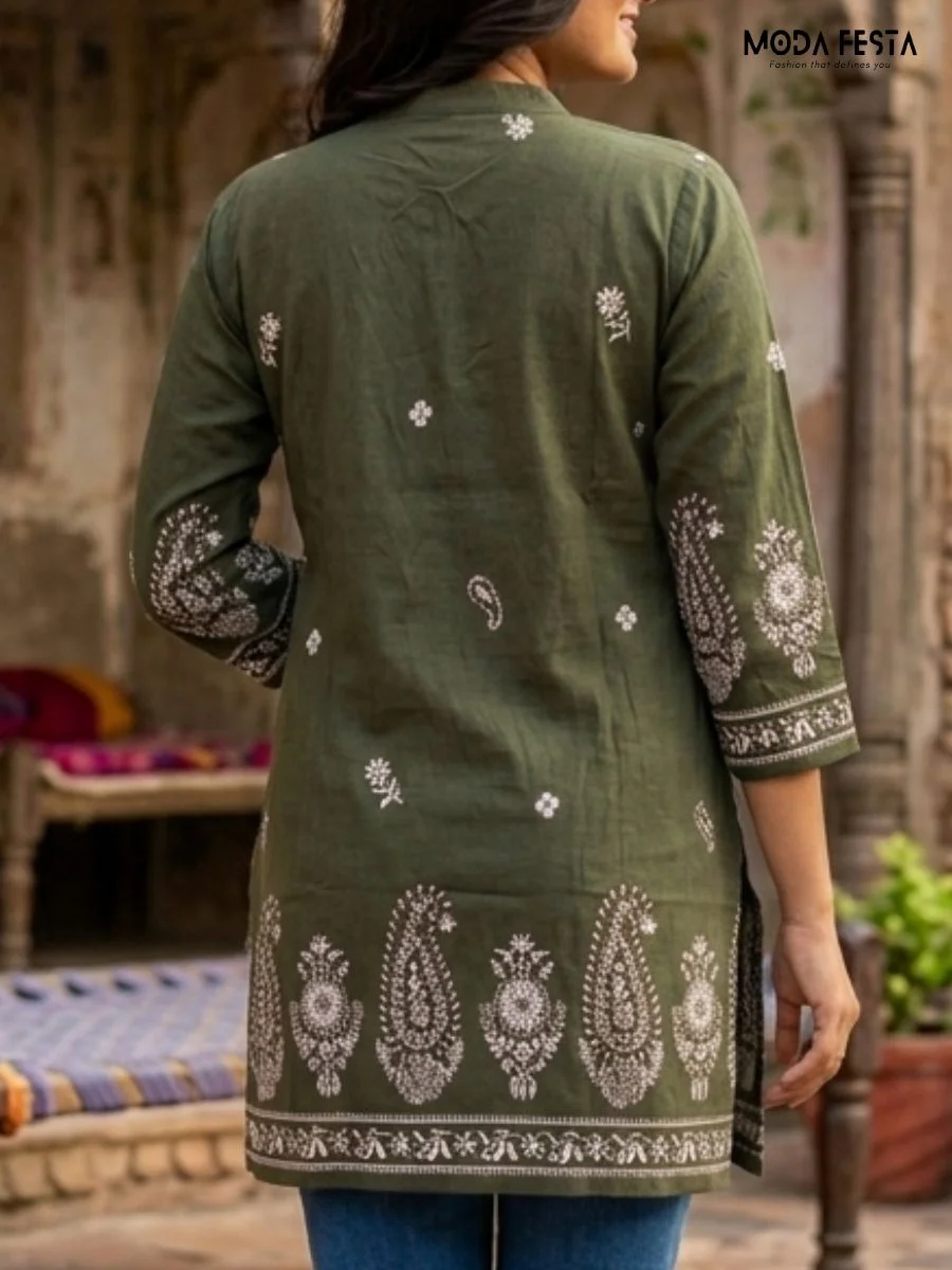This sophisticated olive green kurti features intricate white paisley embroidery and a classic mandarin collar, offering a refined blend of traditional aesthetics