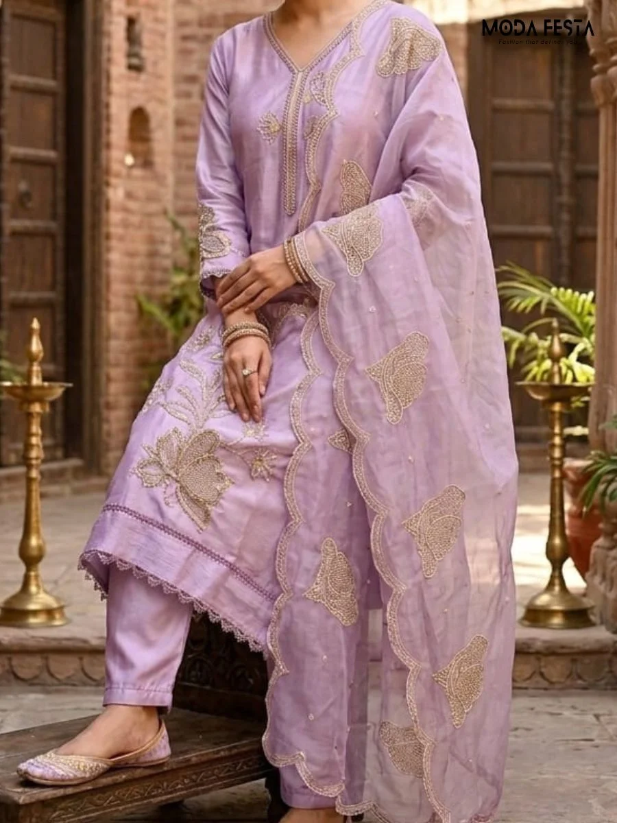 This elegant lavender co-ord set features intricate floral embroidery and scalloped edges on the dupatta, offering a graceful and sophisticated look.