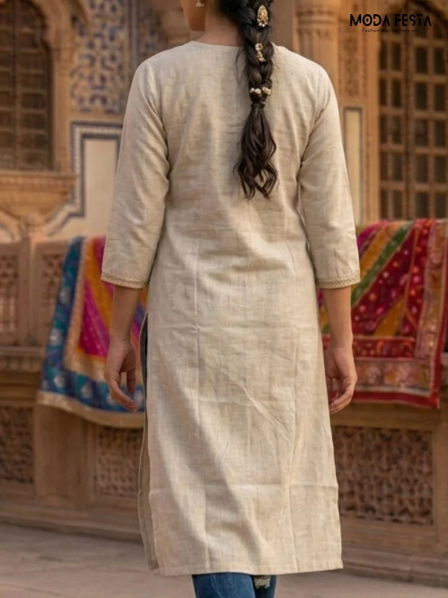 A timeless and versatile beige kurti, featuring a clean, minimalist design perfect for effortless everyday styling.