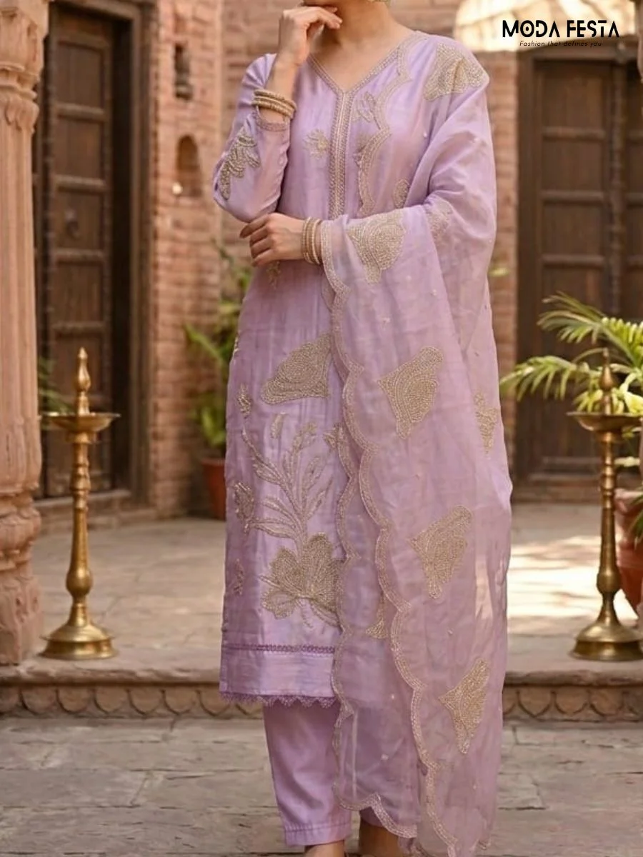 This elegant lavender co-ord set features intricate floral embroidery and scalloped edges on the dupatta, offering a graceful and sophisticated look.