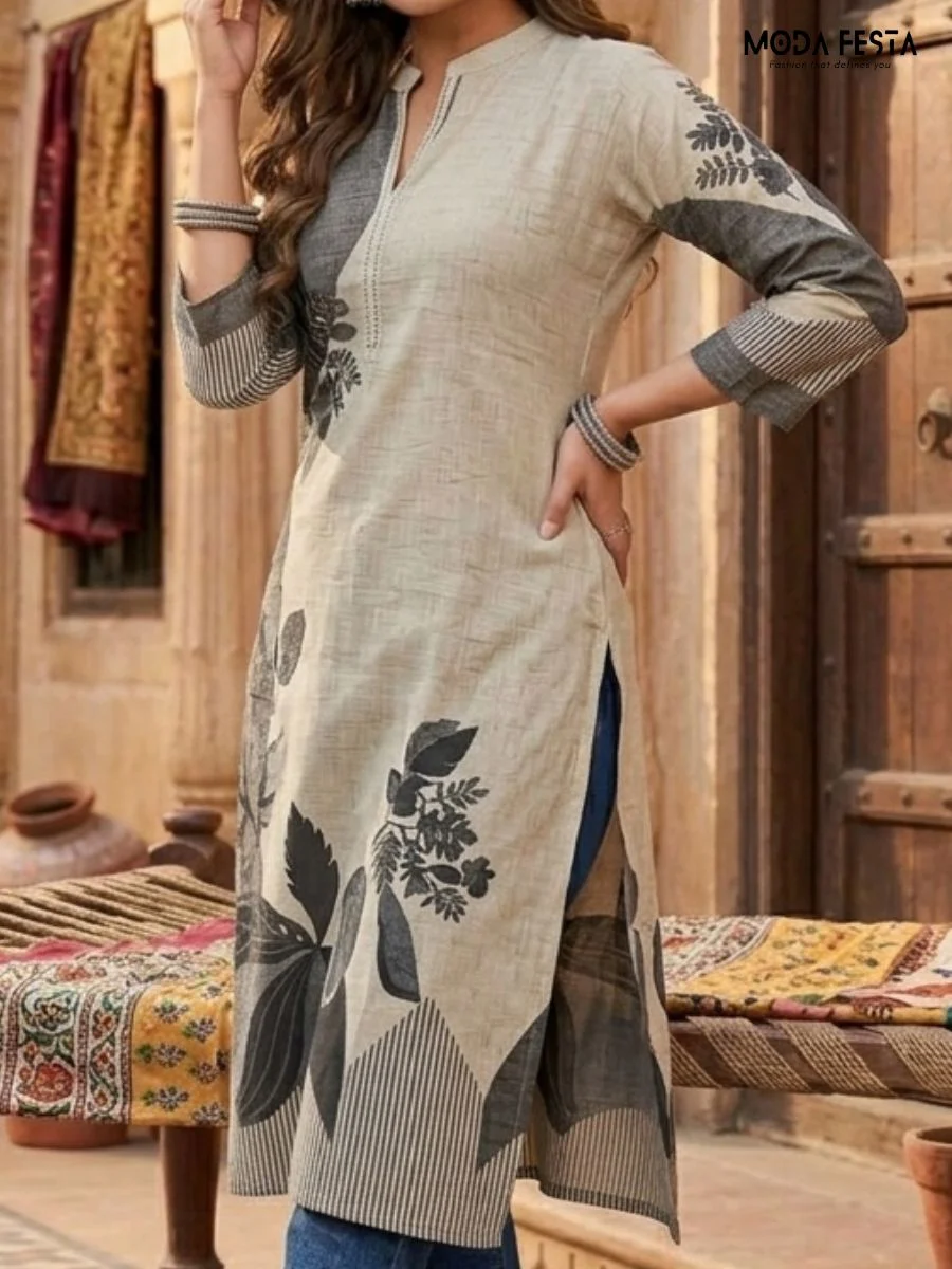 This sophisticated straight-cut kurti showcases a striking monochrome floral motif against a textured neutral base, finished with a sleek mandarin collar.