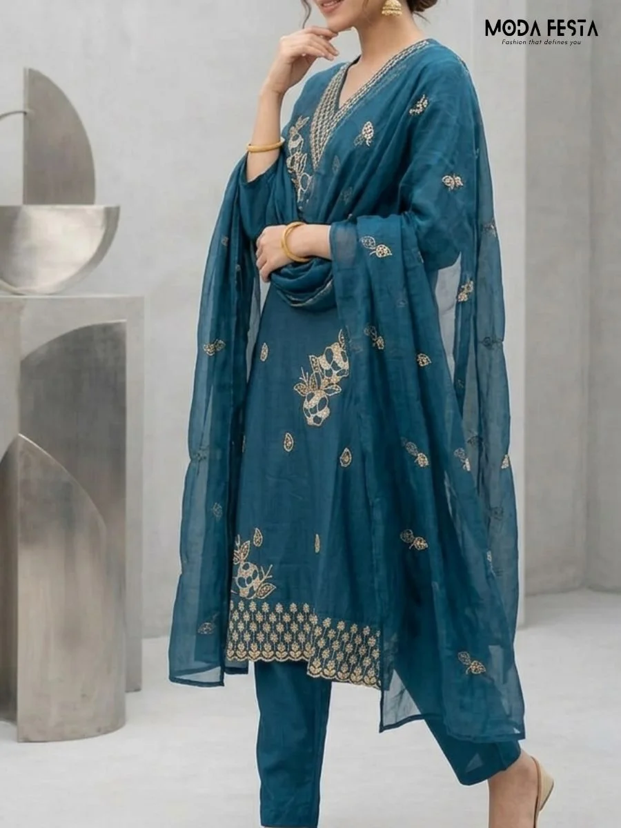 This sophisticated teal co-ord set features elegant gold thread embroidery on the neckline and kurta, paired with a matching sheer dupatta for a refined look.