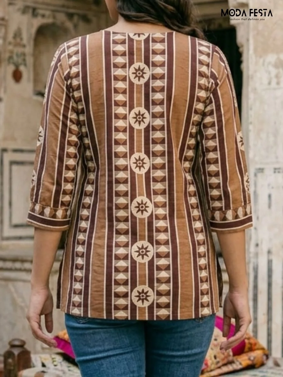 This elegant brown kurti features a bold, vertical geometric pattern that combines traditional ethnic style with a modern, relaxed fit.