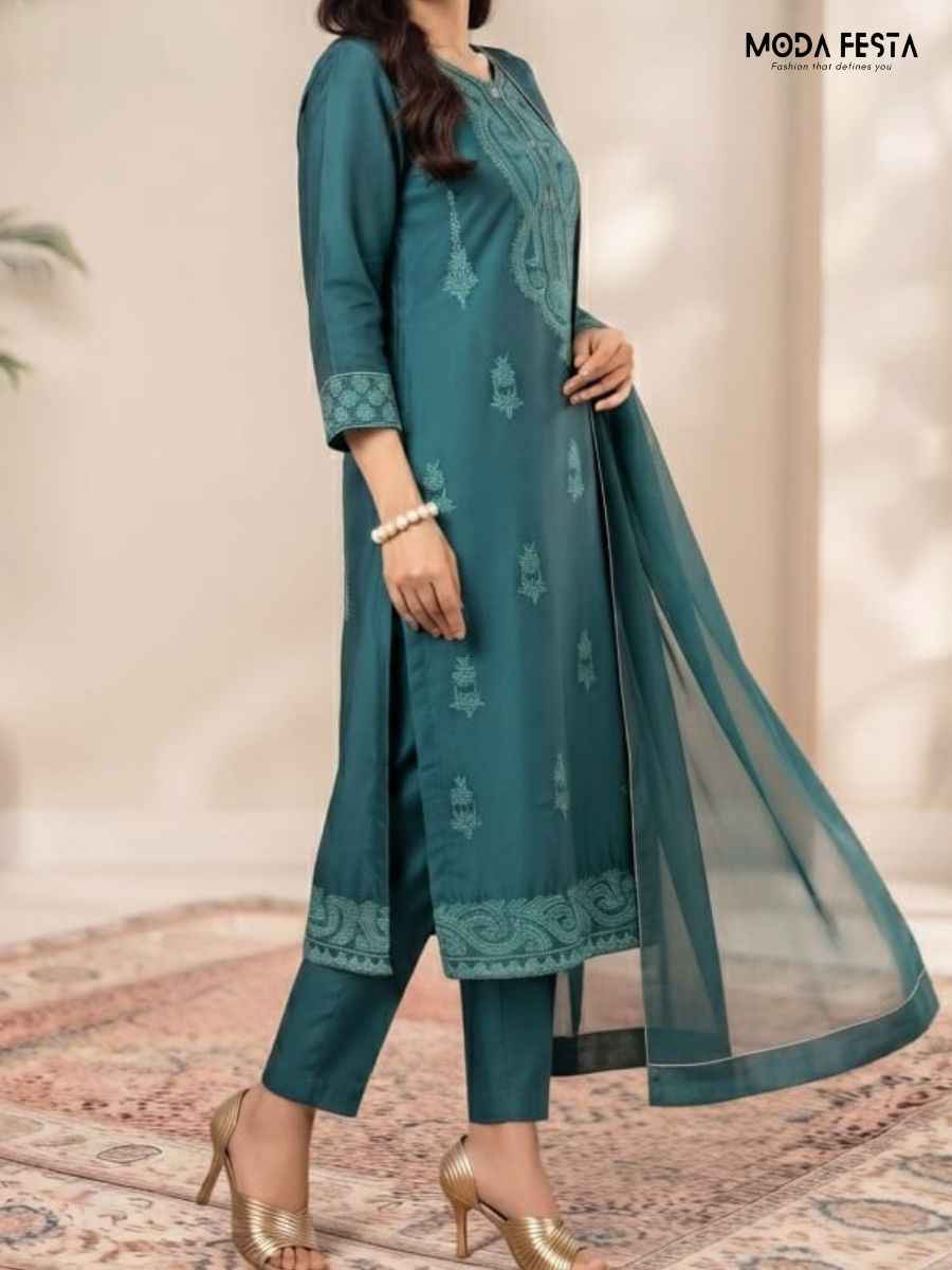 Classy Kurti Set This elegant ensemble includes a straight-cut top paired with matching ankle-length trousers and a lightweight flowing dupatta making it a perfect choice for festive occasions family gatherings and celebrations
