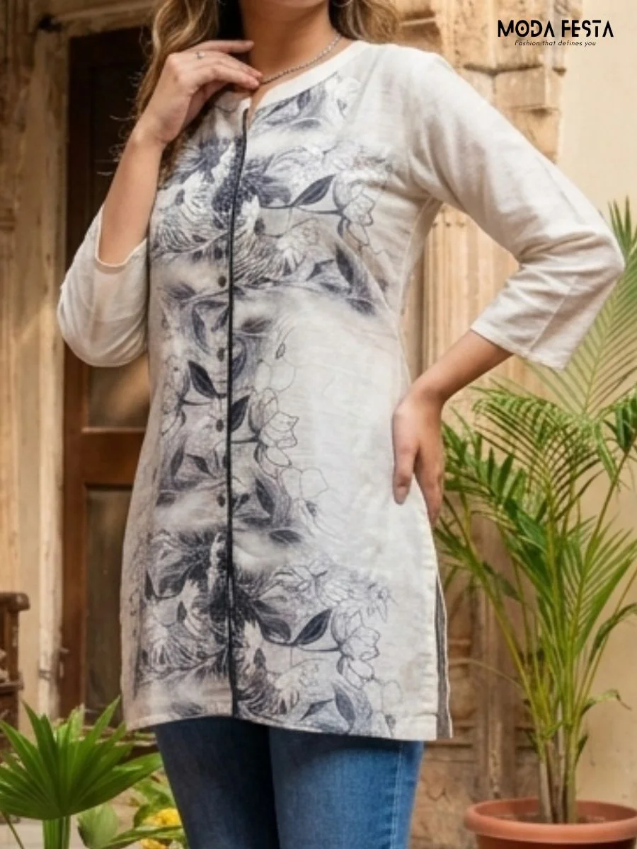 This elegant, off-white kurti features a sophisticated charcoal floral print and a sleek button-down placket, creating a versatile piece for effortless everyday styling.