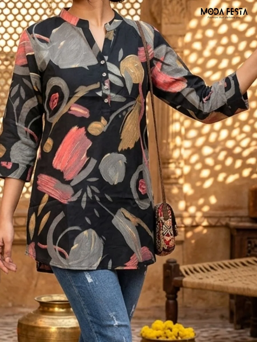 This sophisticated short kurti features a dark base adorned with an elegant, muted botanical floral print and is styled with a classic mandarin collar.