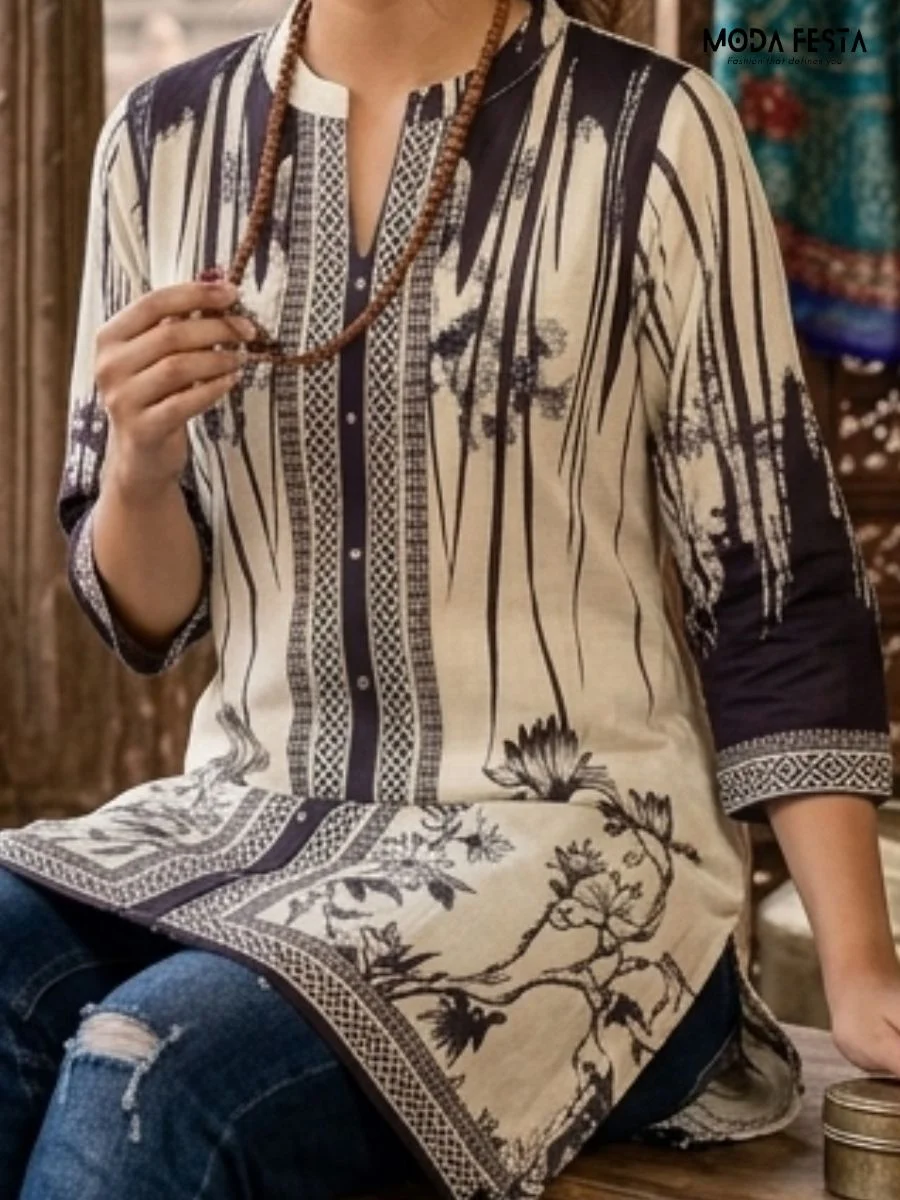 This sophisticated monochromatic kurti features an artistic blend of bold floral prints and intricate geometric paneling, accented by a refined mandarin collar.