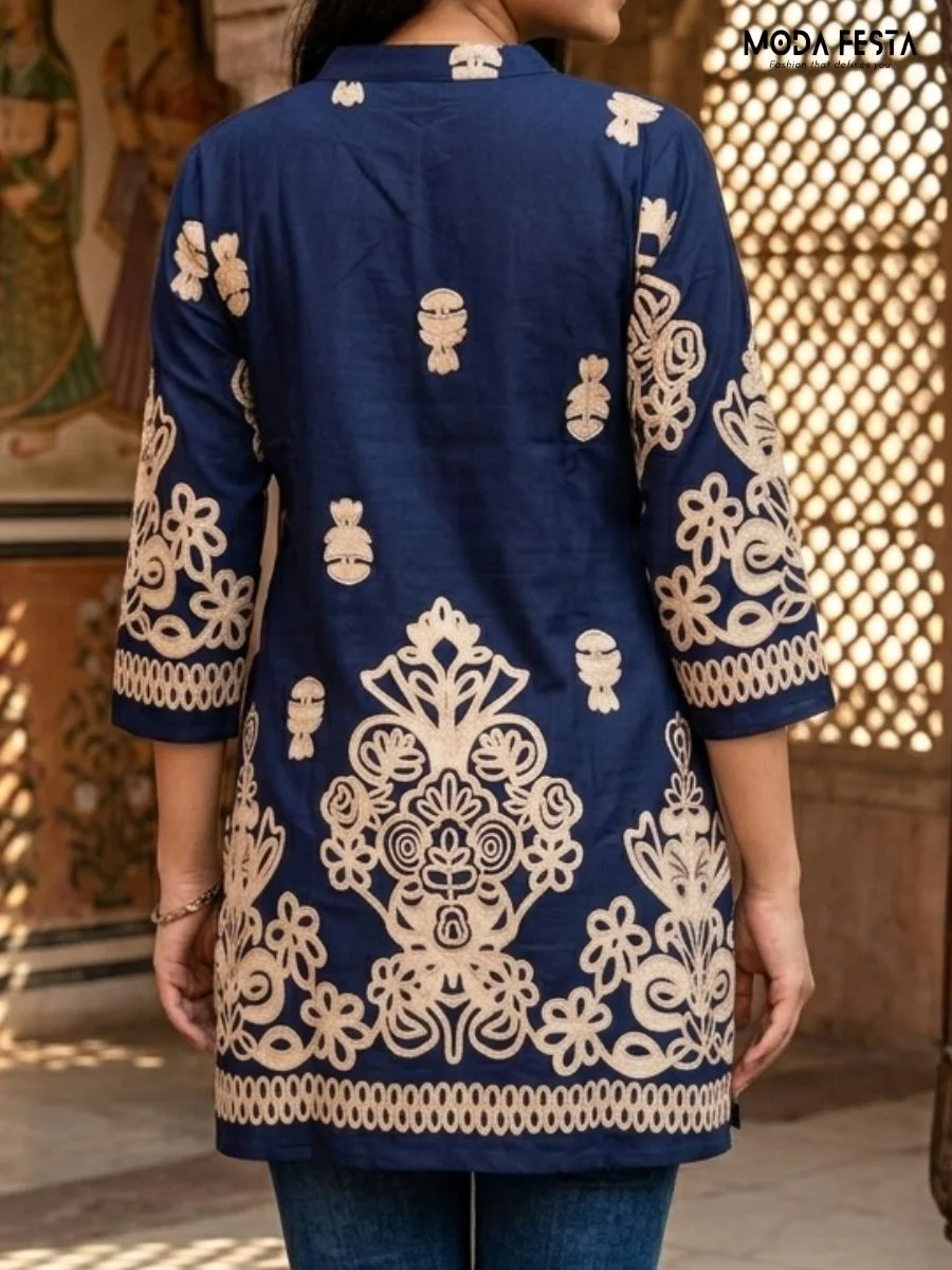 Make a statement with this elegant navy blue kurta, featuring intricate beige embroidery and a sophisticated band-collar neckline.