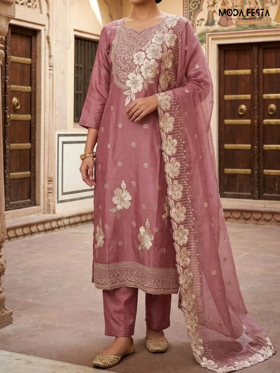 This elegant mauve co-ord set features intricate floral embroidery on the kurta and dupatta, offering a sophisticated and graceful look.